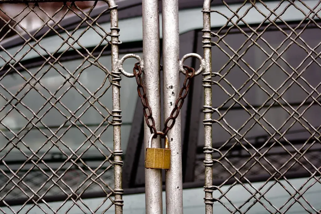 Metal gate being prepared for a fresh coat of rust-inhibiting paint - best paint for outdoor gate